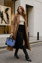 Woman styling a blue Everlasting Union Motif Zhuang brocade tote bag with a business outfit