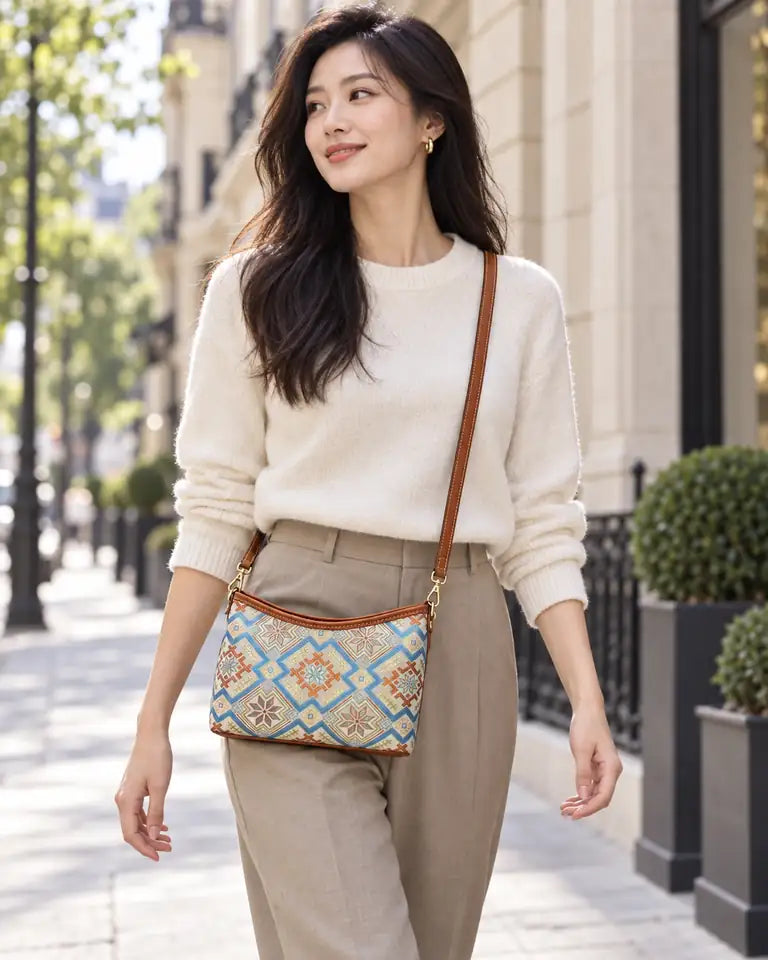 Woman wearing a pastel Chinese brocade crossbody bag