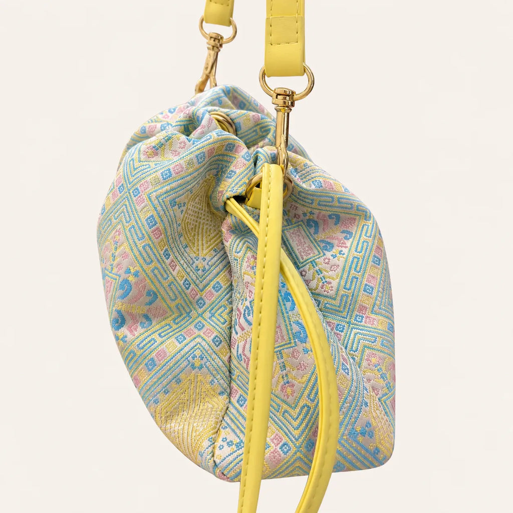 Longevity pattern crossbody bag hardware detail