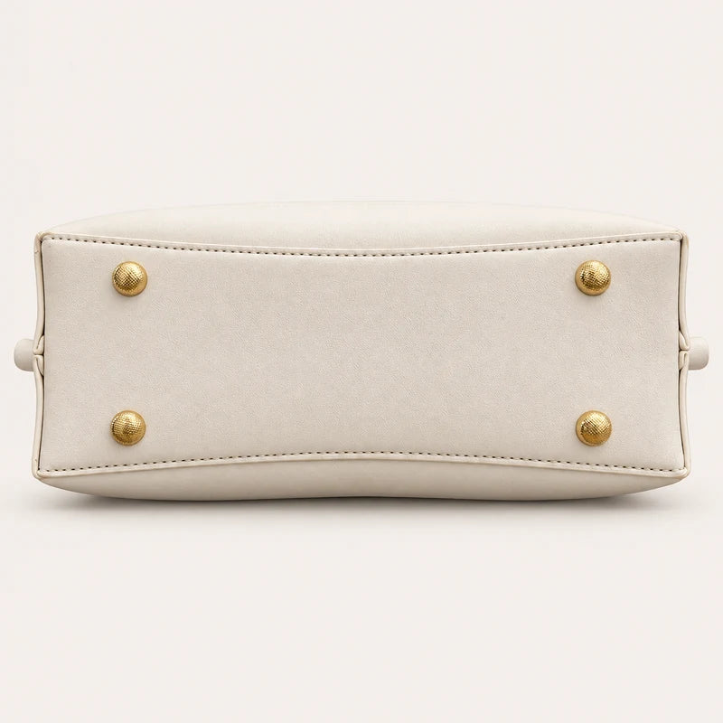 Vegan leather base with protective feet on the Longevity Motif tote bag