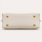 Vegan leather base with protective feet on the Longevity Motif tote bag