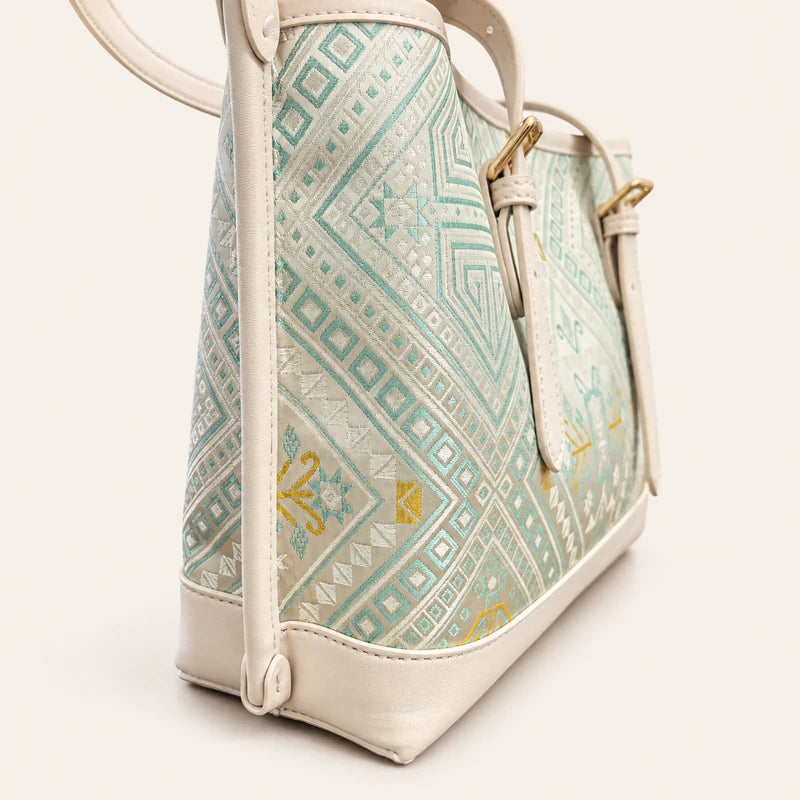 Longevity Motif Zhuang brocade tote bag with vegan leather trim, left side view