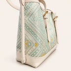 Longevity Motif Zhuang brocade tote bag with vegan leather trim, left side view