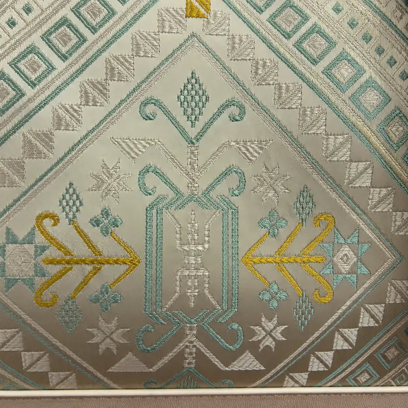 Mint green Longevity Motif woven detail on Zhuang brocade