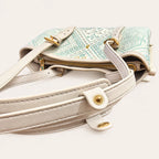 Longevity Motif tote bag strap stitching and magnetic snap detail