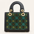 Zhuang brocade top-handle handbag with Wealth-Bringing Swallow Motif, front view