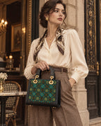Structured Zhuang brocade top-handle handbag with Wealth-Bringing Swallow Motif, styled view