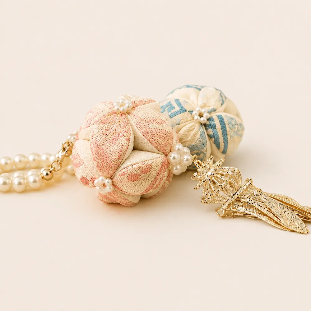 Handcrafted Xiuqiu Embroidered Ball Charm — woven pattern detail