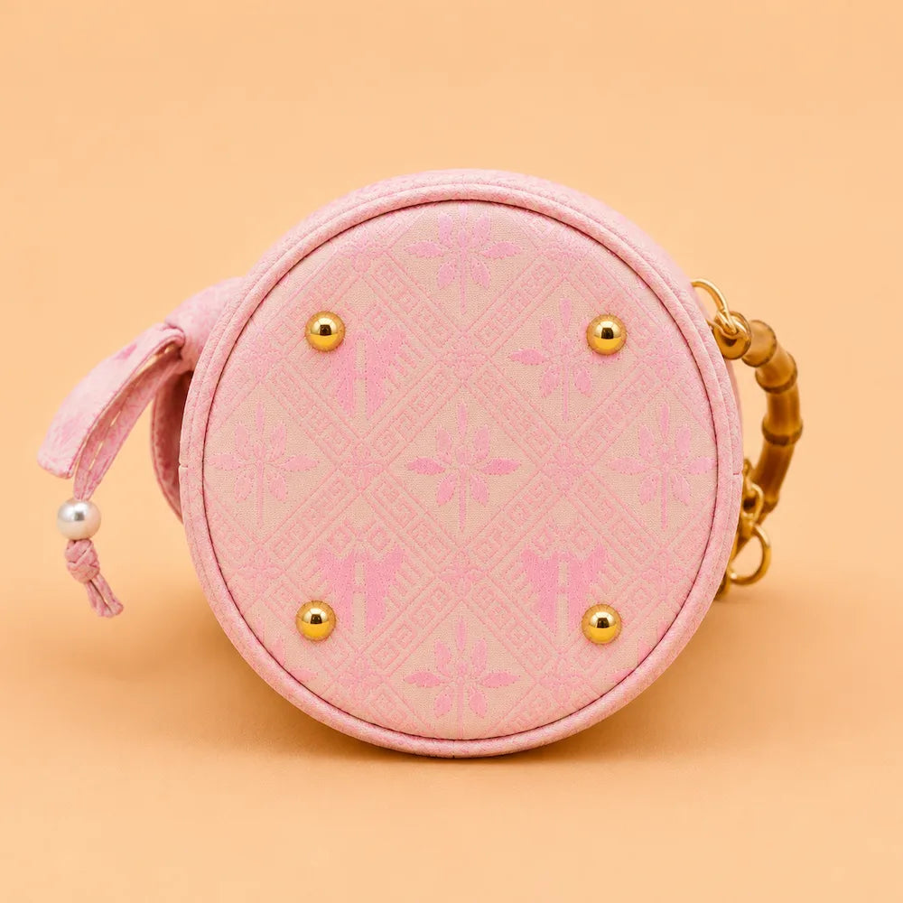 Chinese Brocade Handbag – Twin Fish Lotus Pattern — styling and carrying view